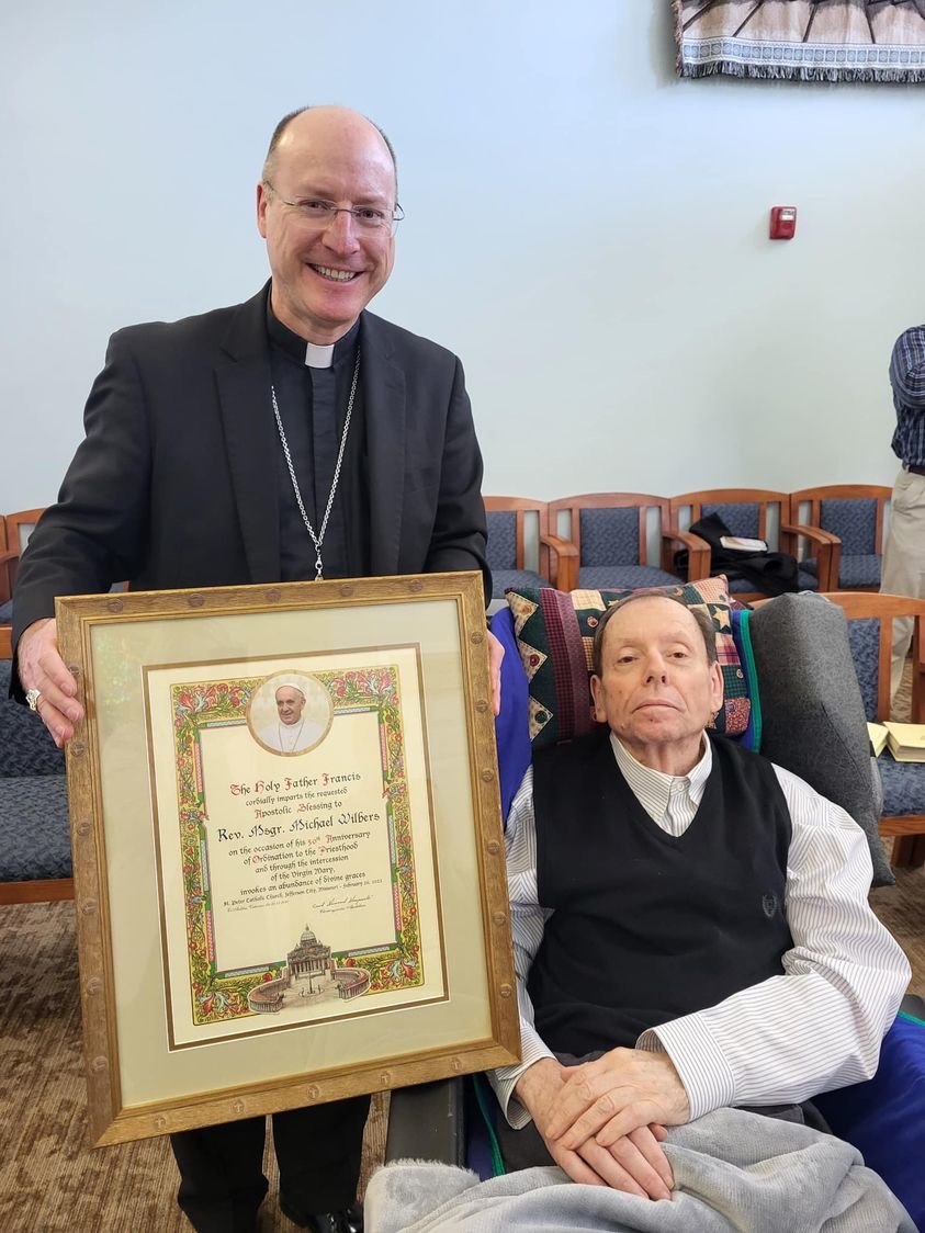 Bishop McKnight honors Msgr. Wilbers on his 50th priestly anniversary.